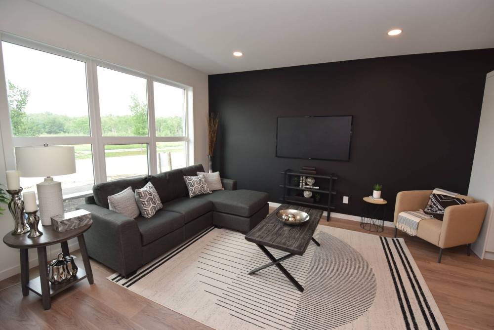 TODD LEWYS / FREE PRESS
The spacious great room offers a lovely view of the park across the street through the grand window on its rear wall.