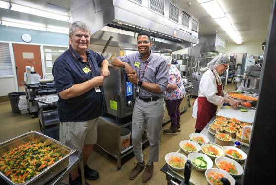 Gary Ledoux (right), director of Bethania Personal Care Home, and Delroy Clarke, director of food and environmental services, in the kitchen where staff are preparing lunch for care home residents. (Ruth Bonneville / Free Press)
