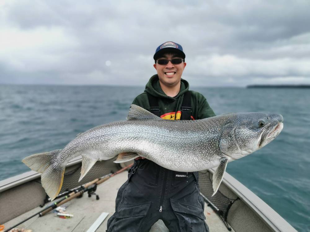 Shu-Mon Mok with a lake trout caught on Clearwater Lake in Manitoba. ‘The sport humbles you all the time,’ he says. ‘You just try to figure out how you can improve your game next time. (Supplied photo)