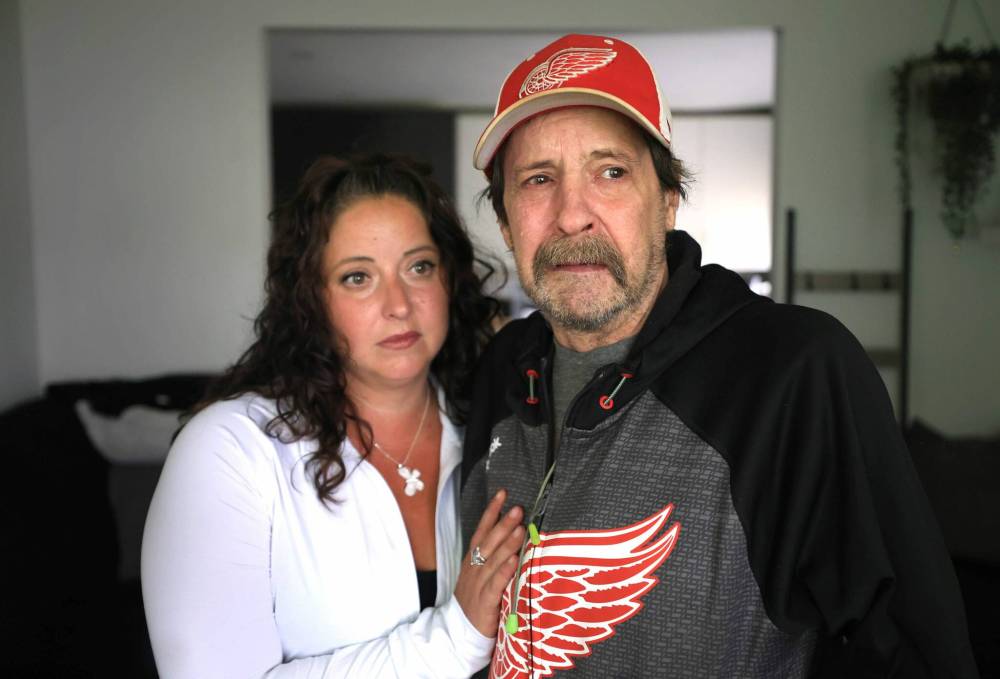 Ruth Bonneville / Free Press
Tricia Schneider comforting her dad Gary Schneider who had his bank account emptied by someone posing as an RCMP officer on the phone.