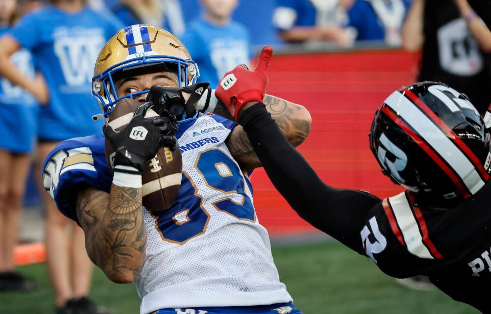 John Woods / THE CANADIAN PRESS
Bombers’ receiver Jerreth Sterns pulls in a touchdown pass against the Redblacks’ Adarius Pickett during the first half Thursday.