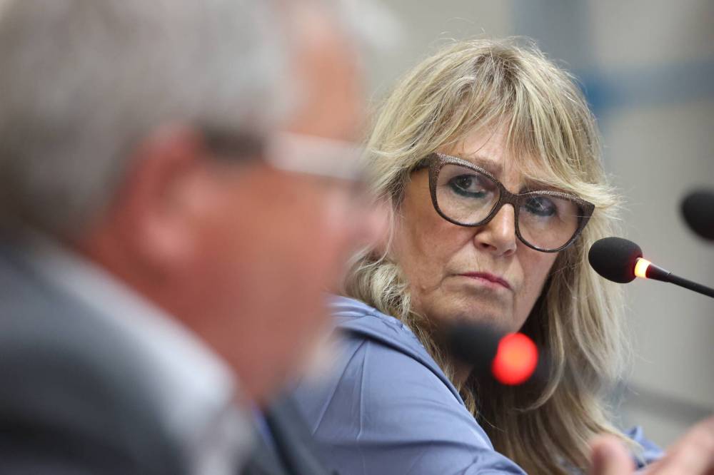 Spruce Woods Progressive Conservative candidate Colleen Robbins watches as NDP candidate Ray Berthelette answers a question from the panel during the second political debate of the byelection campaign on Wednesday evening, hosted by the Brandon Sun, Brandon University and WCGtv in the community of Sprucewoods. (Matt Goerzen/The Brandon Sun)