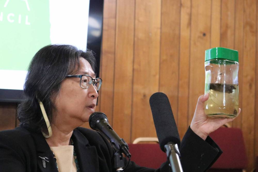 Jenny Schlect, Agweek
Madeline Luke, ag committee volunteer for Dakota Resource Council, holds a jar containing cattle waste and water that she mixed to represent potential contamination from large-scale dairy operations during a rally in Bismarck, N.D. Thursday.