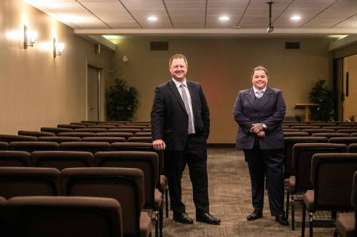 MIKAELA MACKENZIE / FREE PRESS
                                Jotham Koslowsky (left) and Danielle Froese, co-owners, licensed funeral directors and embalmers at Friends Funeral Service Inc, in the chapel on Monday, Aug. 11, 2025. For Aaron story. Winnipeg Free Press 2025