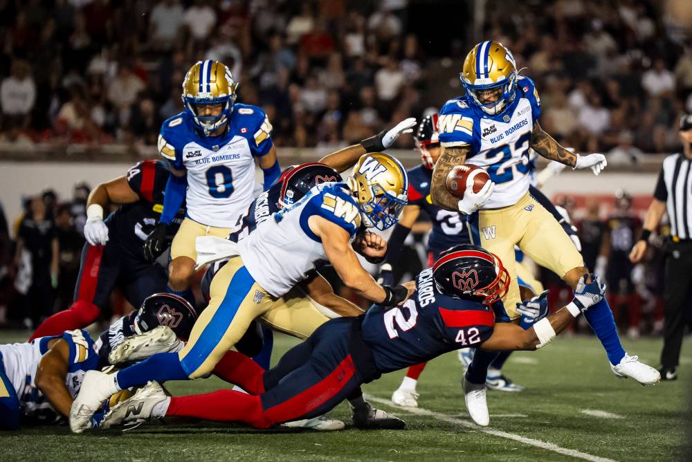 Christopher Katsarov / THE CANADIAN PRESS
                                Winnipeg Blue Bombers’ Trey Vaval runs with the ball during a kick return against the Alouettes, Thursday.