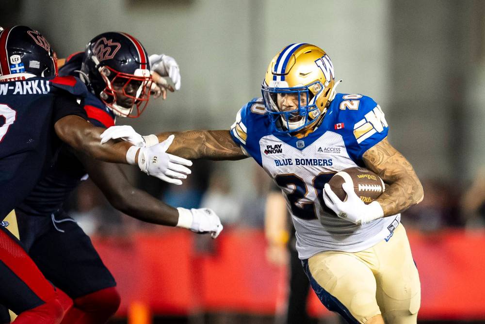 Christopher Katsarov / THE CANADIAN PRESS
                                Brady Oliveira had a dominating night, accumulating more than 200 yards combined rushing and receiving in the Bombers victory over the Alouettes.