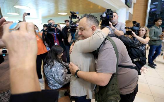 Jonathan Hooker shares a hug with his biological mother, Patsy George. Hooker is among an estimated 20,000 Indigenous children taken from their families during the ’60s Scoop, (Ruth Bonneville / Free Press)