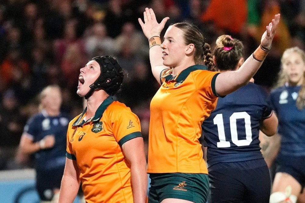 Australia's Caitlyn Halse, right, celebrates scoring a try against the United States during the Women's Rugby World Cup 2025 Pool A match at York Community Stadium, Saturday, Aug. 30, 2025, in York, England. (Danny Lawson/PA via AP)
