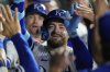 Kansas City Royals' Kyle Isbel celebrates in the dugout after hitting a two-run home run during the sixth inning of a baseball game against the Washington Nationals, Monday, Aug. 11, 2025, in Kansas City, Mo. (AP Photo/Charlie Riedel)