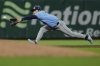 Tampa Bay Rays shortstop Ha-Seong Kim catches a line drive hit by San Francisco Giants' Dominic Smith to end the eighth inning of a baseball game, Saturday, Aug. 16, 2025, in San Francisco. (AP Photo/Godofredo A. Vásquez)