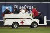 Arizona Diamondbacks' Lourdes Gurriel Jr., third from left, is taken out on a cart after diving for a ball hit by Texas Rangers' Rowdy Tellez in the sixth inning of a baseball game, Monday, Sept. 1, 2025, in Phoenix. (AP Photo/Rick Scuteri)