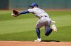 Toronto Blue Jays second baseman Andres Gimenez fields a ground ball in the third inning of a Major League Baseball game in Cleveland on Thursday, June 26, 2025. (AP Photo/Sue Ogrocki)