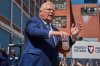 Ontario Premier Doug Ford empties a Crown Royal bottle of whisky at a press conference in Kitchener, Ont., on Tuesday, Sept. 2, 2025. Ford criticized the popular whisky's parent company, Diageo, for their plan to close one of their Ontario bottling plants in the coming months. THE CANADIAN PRESS/Sammy Kogan
