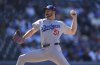 Los Angeles Dodgers relief pitcher Alex Vesia works against the Colorado Rockies in the ninth inning of a baseball game Thursday, Aug. 21, 2025, in Denver. (AP Photo/David Zalubowski)