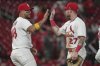 St. Louis Cardinals' Ivan Herrera (48) and Nathan Church (27) celebrate a victory over the Athletics in a baseball game Tuesday, Sept. 2, 2025, in St. Louis. (AP Photo/Jeff Roberson)