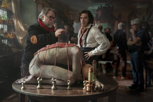 This image released by Netflix shows director Guillermo del Toro, left, and Oscar Isaac on the set of 