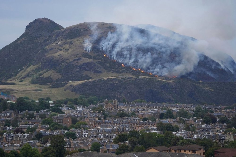A view of a fire on Arthur's Seat in Holyrood Park, in Edinburgh, Scotland, Sunday Aug. 10, 2025. (Jane Barlow/PA via AP)