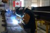 A worker welds at a steel manufacturing facility, in Hamilton, Ont., Wednesday, July 16, 2025. THE CANADIAN PRESS/Chris Young
