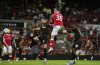 Wrexham's Ollie Palmer, top, scores during the English League Cup first round soccer match between Wrexham and Hull City at SToK Racecourse, Wrexham, Wales, Tuesday Aug. 12, 2025. (Nick Potts/PA via AP)