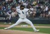 Chicago White Sox starting pitcher Yoendrys Gomez throws during the first inning of a baseball game against the Detroit Tigers, Tuesday, Aug. 12, 2025 in Chicago. (AP Photo/Talia Sprague)