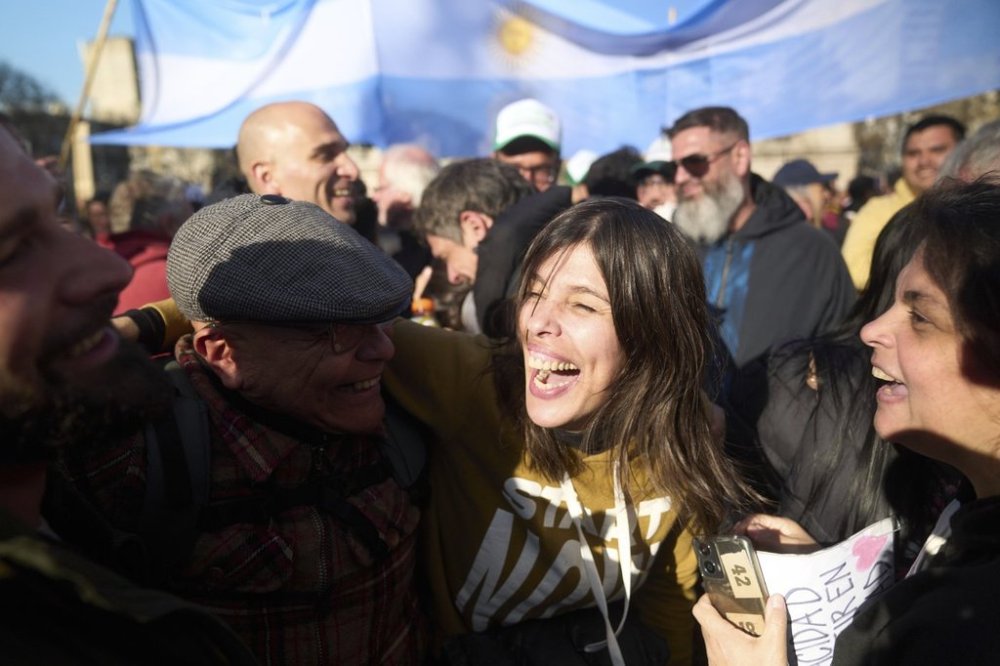 Actress Valentina Bassi, mother of a son with autism, celebrates after senators rejected President Javier Milei's veto of a bill to expand protections for people with disabilities, in Buenos Aires, Argentina, Thursday, Sept. 4, 2025. (AP Photo/Victor R. Caivano)