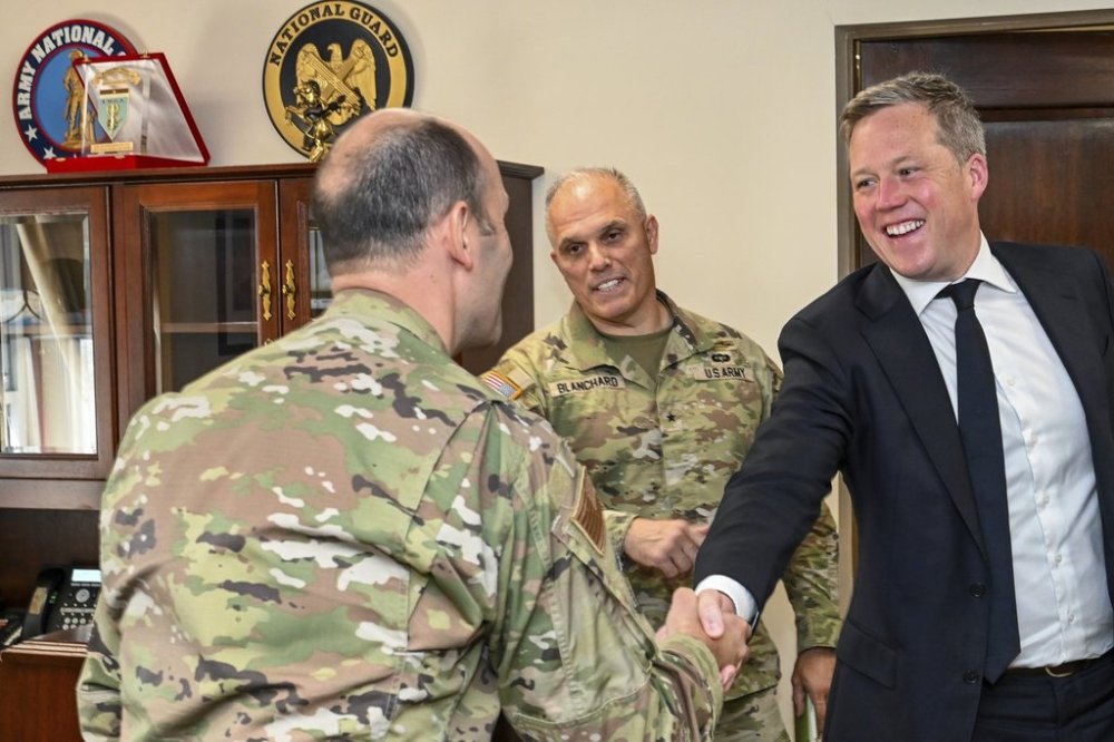 In this image provided by the U.S. Army National Guard, Secretary of the Army Dan Driscoll shakes hands with Air Force Brig. Gen. Matthew McDonough, commander of the 113th wing, left, during a visit with soldiers and airmen from the District of Columbia National Guard at the D.C. National Guard Armory in Washington, Tuesday, Aug. 12, 2025. (Sgt. 1st Class Christy L. Sherman/U.S. Army National Guard via AP)