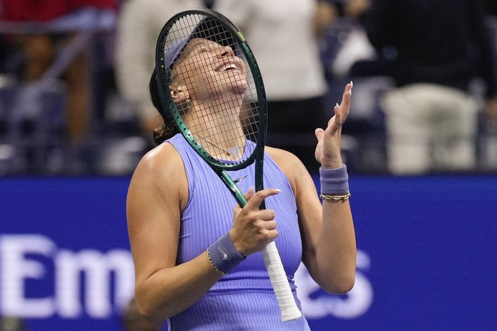 Amanda Anisimova, of the United States, reacts after defeating Naomi Osaka, of Japan, during the women's singles semifinals of the U.S. Open tennis championships, Friday, Sept. 5, 2025, in New York. (AP Photo/Seth Wenig)