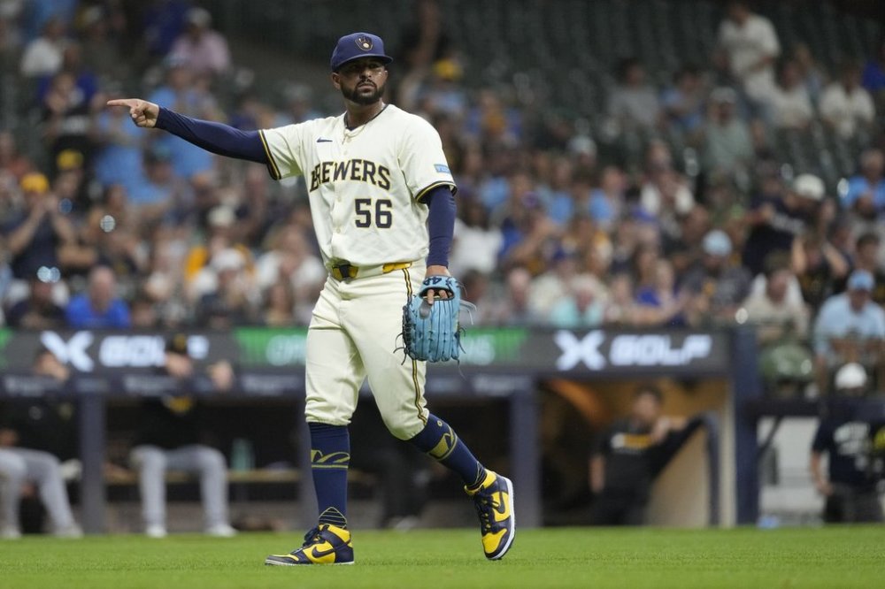 Milwaukee Brewers' Grant Anderson gestures as he walks to the dugout during the seventh inning of a baseball game against the Pittsburgh Pirates, Monday, Aug. 11, 2025, in Milwaukee. (AP Photo/Aaron Gash)