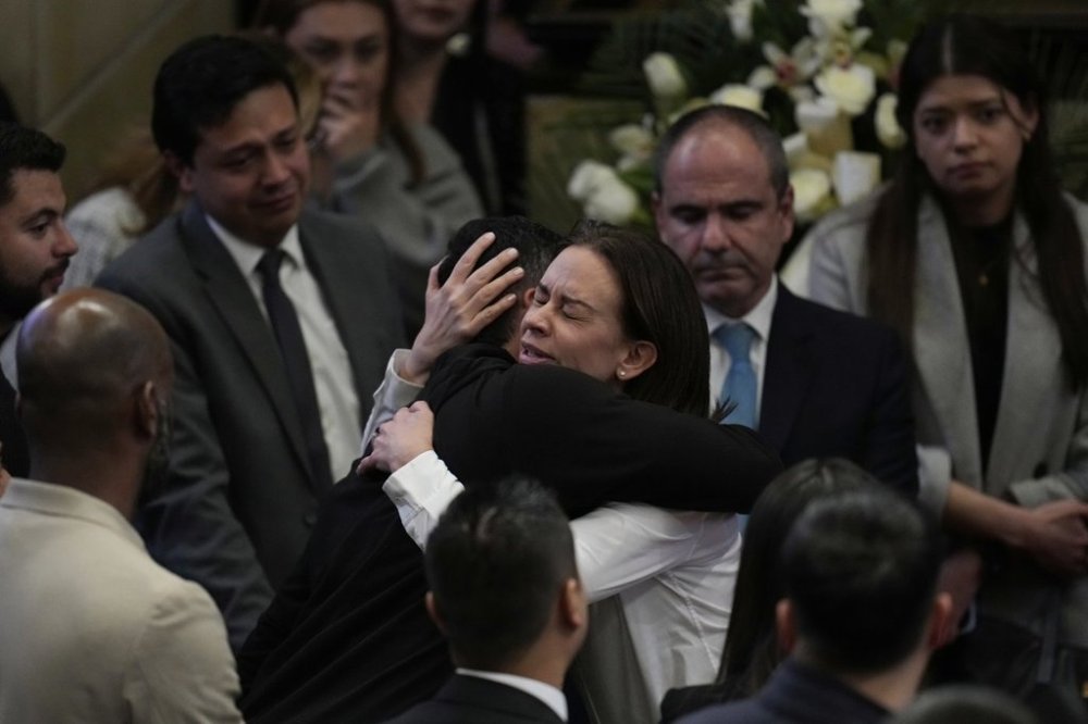 Claudia Tarazona, the wife of opposition Sen. and presidential hopeful Miguel Uribe, who died from wounds suffered when he was shot during a political rally, attends a ceremony honoring her husband, at Congress in Bogota, Colombia, Monday, Aug. 11, 2025. (AP Photo/Fernando Vergara)
