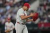 Philadelphia Phillies relief pitcher Jhoan Duran celebrates after getting the final out against the Texas Rangers in a baseball game Sunday, Aug. 10, 2025, in Arlington, Texas. (AP Photo/Tony Gutierrez)