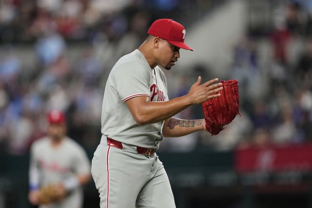Philadelphia Phillies relief pitcher Jhoan Duran celebrates after getting the final out against the Texas Rangers in a baseball game Sunday, Aug. 10, 2025, in Arlington, Texas. (AP Photo/Tony Gutierrez)