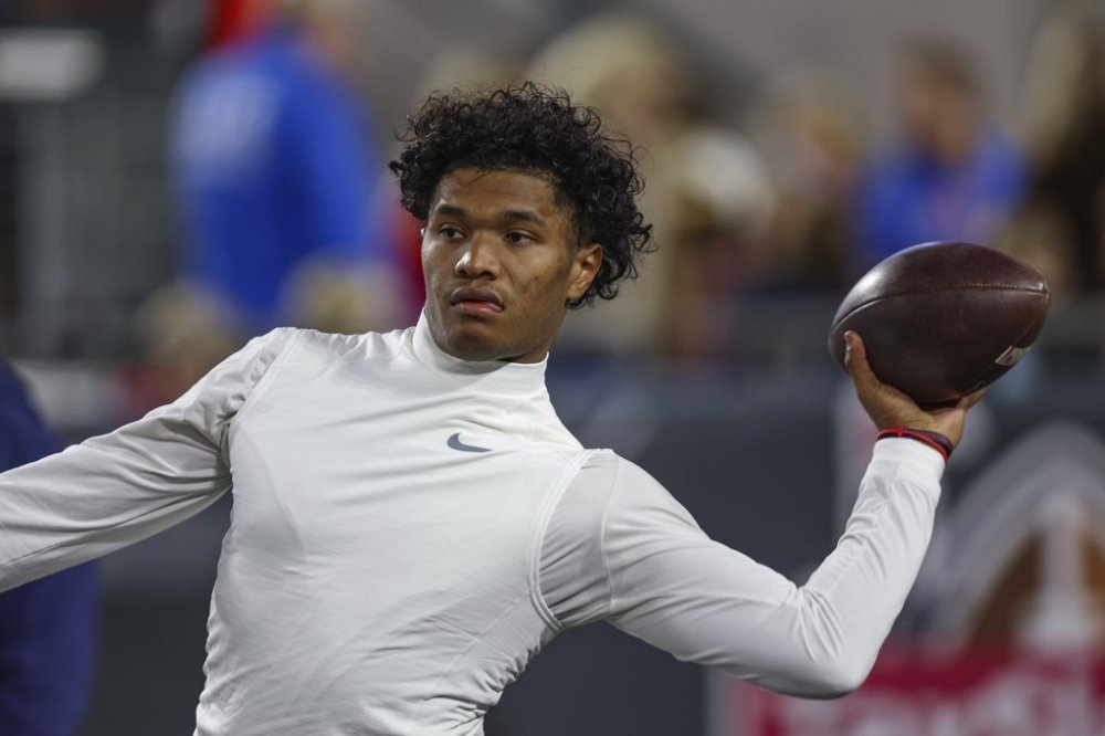 FILE - Mississippi quarterback Austin Simmons warms up before facing Duke in the Gator Bowl NCAA college football game in Jacksonville, Fla., Jan. 2, 2025. (AP Photo/Gary McCullough)