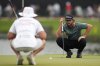 Cameron Young lines up his putt on the 15th green during the third round of the Tour Championship golf tournament, Saturday, Aug. 23, 2025, in Atlanta. (AP Photo/Mike Stewart)