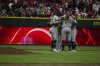 The Milwaukee Brewers infield react after defeating the Cincinnati Reds in a baseball game, Saturday, Aug. 16, 2025, in Cincinnati. (AP Photo/Michael Swensen)