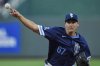 Kansas City Royals starting pitcher Seth Lugo throws during the first inning of a baseball game against the Detroit Tigers, Friday, Aug. 29, 2025, in Kansas City, Mo. (AP Photo/Charlie Riedel)