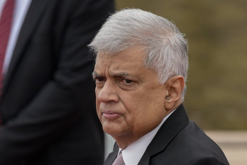 FILE -Sri Lankan president Ranil Wickremesinghe inspects a military guard of honour after arriving at the parliamentary complex in Colombo, Sri Lanka, Aug. 3, 2022. (AP Photo/Eranga Jayawardena, File)