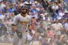 Pittsburgh Pirates' Isiah Kiner-Falefa scores during the third inning of a baseball game against the Chicago Cubs, Sunday, Aug. 17, 2025, at Wrigley Field in Chicago. (AP Photo/Mark Black)