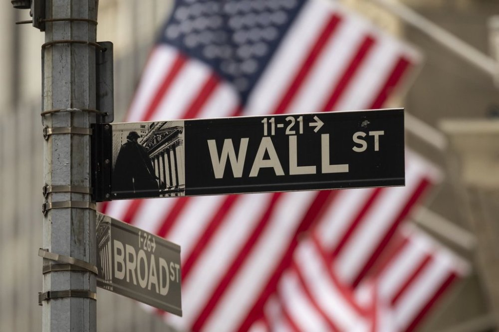 Wall St sign is seen outside the New York Stock Exchange, Thursday, April 10, 2025, in New York. (AP Photo/Yuki Iwamura)