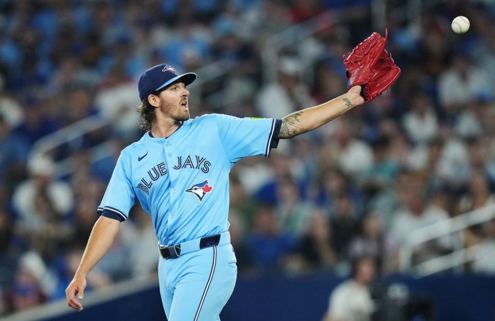 Blue Jays pitcher Kevin Gausman (34) receives the ball from his catcher during the third inning of a Major League Baseball game against the Chicago Cubs in Toronto on Wednesday, August 13, 2025. THE CANADIAN PRESS/Nathan Denette