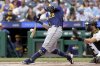Milwaukee Brewers' Andrew Vaughn hits an RBI single during the first inning of a baseball game against the Pittsburgh Pirates, Sunday, Sept. 7, 2025, in Pittsburgh. (AP Photo/Matt Freed)