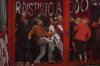 Fans of Argentina's Independiente bang on a barrier during a Copa Sudamericana round of sixteen second leg soccer match against Universidad de Chile at the Libertadores de America stadium in Avellaneda, Argentina, Wednesday, Aug. 20, 2025. (AP Photo/Gustavo Garello)