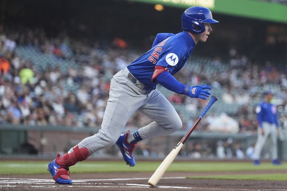 Chicago Cubs' Pete Crow-Armstrong runs to first base after hitting a single against the San Francisco Giants during the first inning of a baseball game in San Francisco, Tuesday, Aug. 26, 2025. (AP Photo/Jeff Chiu)