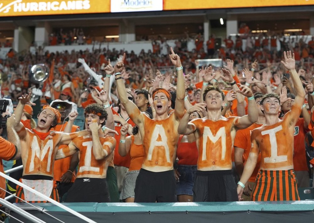 Miami fans sing during the second half of an NCAA college football game against Notre Dame, Sunday, Aug. 31, 2025, in Miami Gardens, Fla. (AP Photo/Lynne Sladky)
