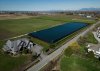 In this photograph taken with a drone, a water storage area is seen near on farmland at Westcoast Vegetables in Delta, B.C., on Monday, March 18, 2024. THE CANADIAN PRESS/Darryl Dyck