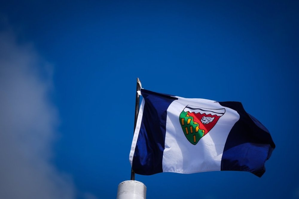 A Northwest Territories flag flies in the wind, in Inuvik, N.W.T., on Thursday, July 24, 2025. THE CANADIAN PRESS/Darryl Dyck