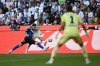 Hamburg's Giorgi Gocholeishvili, left, in a duel with Borussia's Lukas Ullrich during the German Bundesliga soccer match between Borussia Mönchengladbach and Hamburger SV at Borussia-Park in Mönchengladbach, Germany, Sunday Aug. 24, 2025. (Fabian Strauch/dpa via AP)