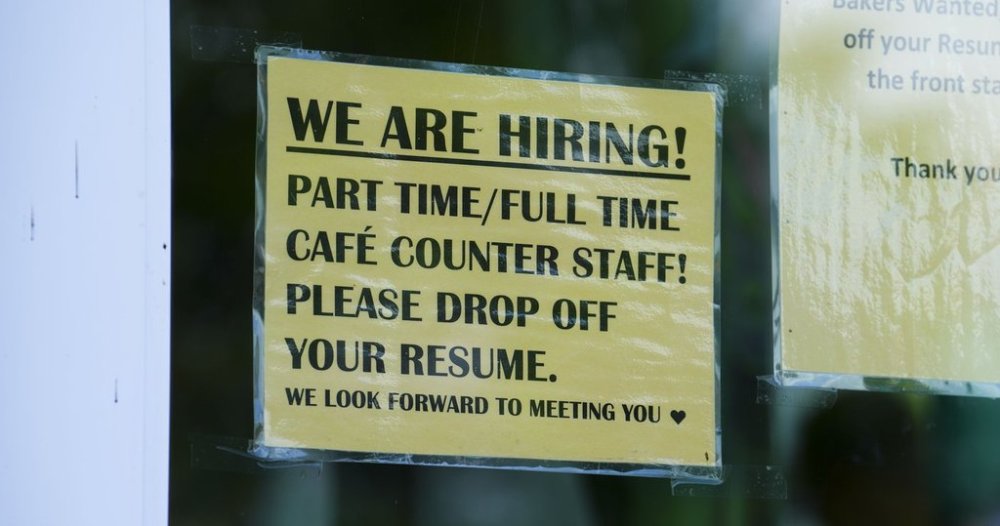 A sign for help wanted is pictured in a business window in Ottawa on Tuesday, July 12, 2022. THE CANADIAN PRESS/Sean Kilpatrick