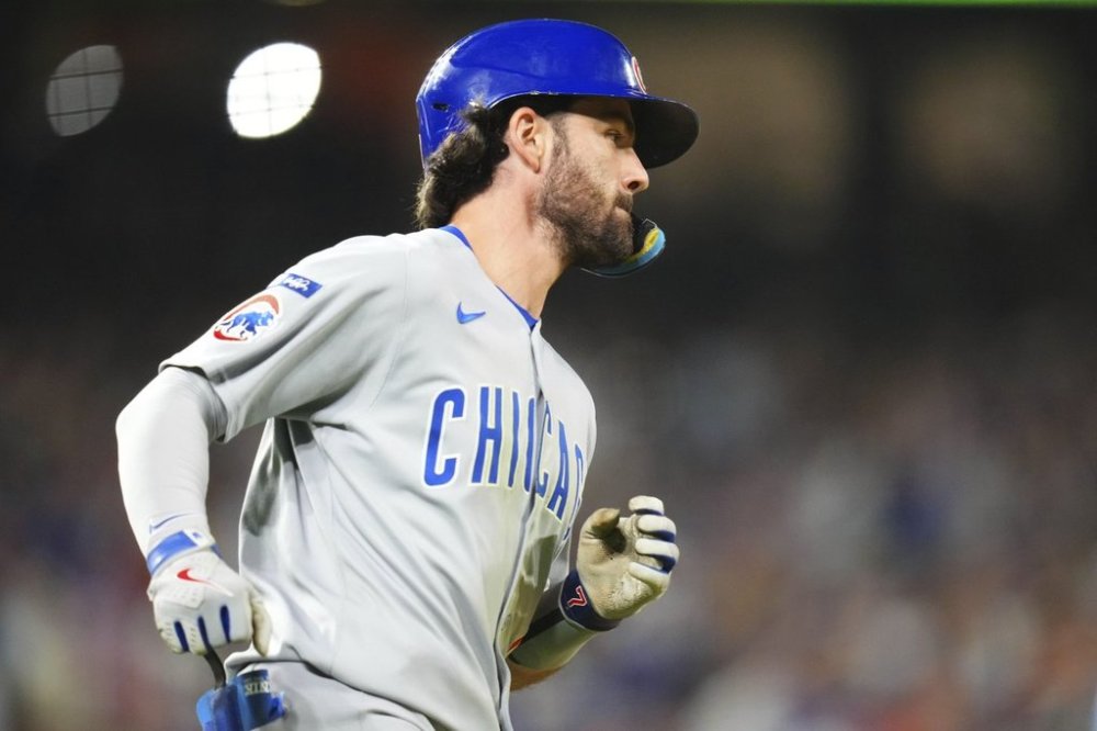 Chicago Cubs' Dansby Swanson rounds the bases after hitting a solo home run against the Colorado Rockies during the seventh inning of a baseball game Friday, Aug. 29, 2025, in Denver. (AP Photo/Jack Dempsey)
