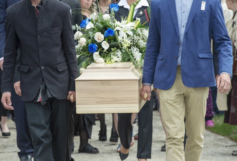 The casket of a seven-year-old girl who was found in critical condition inside a home and later died is carried from a church after funeral services in Granby, Que., Thursday, May 9, 2019. THE CANADIAN PRESS/Ryan Remiorz