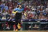 Philadelphia Phillies' Alec Bohm watches after hitting an RBI-sacrifice fly against Atlanta Braves pitcher Pierce Johnson during the eighth inning of a baseball game Friday, Aug. 29, 2025, in Philadelphia. (AP Photo/Matt Slocum)